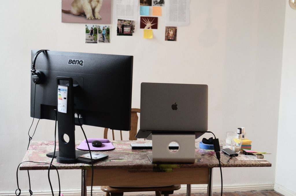 Desk with computer monitors and electronics